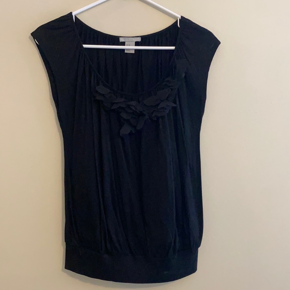 Cute black top with floral decorative neckline